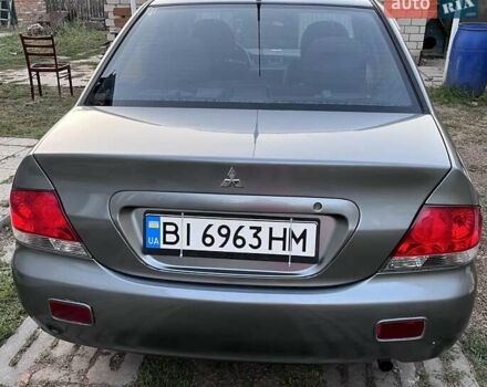 Серый Мицубиси Лансер, объемом двигателя 1.58 л и пробегом 290 тыс. км за 4000 $, фото 3 на Automoto.ua