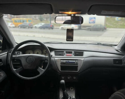 Серый Мицубиси Лансер, объемом двигателя 1.58 л и пробегом 237 тыс. км за 2999 $, фото 11 на Automoto.ua