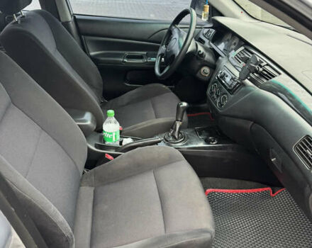 Серый Мицубиси Лансер, объемом двигателя 1.58 л и пробегом 260 тыс. км за 3500 $, фото 11 на Automoto.ua