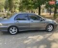 Серый Мицубиси Лансер, объемом двигателя 2 л и пробегом 300 тыс. км за 4300 $, фото 1 на Automoto.ua