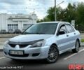 Серый Мицубиси Лансер, объемом двигателя 1.6 л и пробегом 243 тыс. км за 3900 $, фото 1 на Automoto.ua
