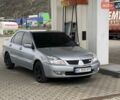 Серый Мицубиси Лансер, объемом двигателя 1.58 л и пробегом 119 тыс. км за 4500 $, фото 1 на Automoto.ua