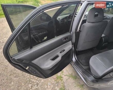 Сірий Міцубісі Lancer, об'ємом двигуна 1.6 л та пробігом 257 тис. км за 3700 $, фото 10 на Automoto.ua