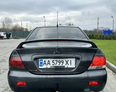 Серый Мицубиси Лансер, объемом двигателя 1.58 л и пробегом 300 тыс. км за 3500 $, фото 2 на Automoto.ua