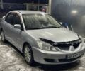 Серый Мицубиси Лансер, объемом двигателя 1.6 л и пробегом 350 тыс. км за 3500 $, фото 1 на Automoto.ua