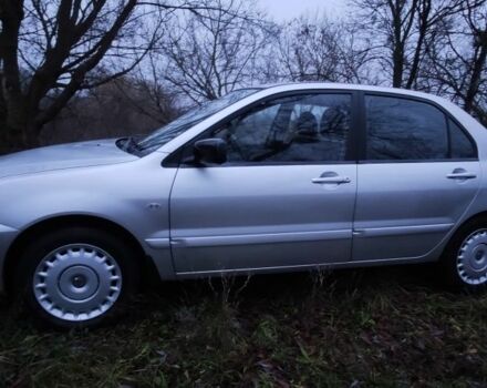 Серый Мицубиси Лансер, объемом двигателя 1.6 л и пробегом 235 тыс. км за 2850 $, фото 7 на Automoto.ua