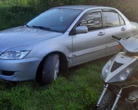 Сірий Міцубісі Lancer, об'ємом двигуна 1.58 л та пробігом 250 тис. км за 5000 $, фото 3 на Automoto.ua