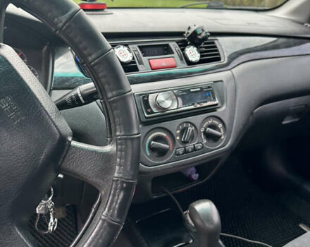 Серый Мицубиси Лансер, объемом двигателя 1.58 л и пробегом 300 тыс. км за 3500 $, фото 4 на Automoto.ua