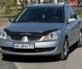 Серый Мицубиси Лансер, объемом двигателя 1.6 л и пробегом 222 тыс. км за 4799 $, фото 1 на Automoto.ua