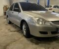 Сірий Міцубісі Lancer, об'ємом двигуна 1.3 л та пробігом 304 тис. км за 3950 $, фото 1 на Automoto.ua