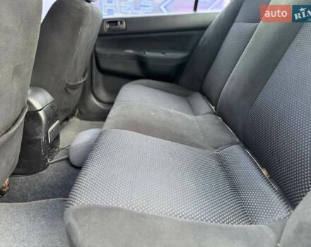 Сірий Міцубісі Lancer, об'ємом двигуна 1.58 л та пробігом 188 тис. км за 3799 $, фото 8 на Automoto.ua