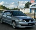 Серый Мицубиси Лансер, объемом двигателя 2 л и пробегом 312 тыс. км за 4699 $, фото 1 на Automoto.ua