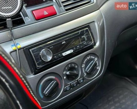 Серый Мицубиси Лансер, объемом двигателя 1.6 л и пробегом 196 тыс. км за 4490 $, фото 19 на Automoto.ua