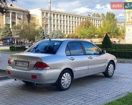 Серый Мицубиси Лансер, объемом двигателя 1.58 л и пробегом 250 тыс. км за 3750 $, фото 1 на Automoto.ua