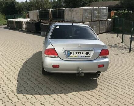 Сірий Міцубісі Lancer, об'ємом двигуна 1.58 л та пробігом 274 тис. км за 4400 $, фото 6 на Automoto.ua