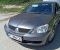 Серый Мицубиси Лансер, объемом двигателя 1.58 л и пробегом 200 тыс. км за 4800 $, фото 1 на Automoto.ua