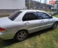 Сірий Міцубісі Lancer, об'ємом двигуна 1.58 л та пробігом 237 тис. км за 3600 $, фото 1 на Automoto.ua