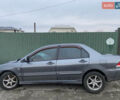Сірий Міцубісі Lancer, об'ємом двигуна 1.58 л та пробігом 230 тис. км за 1400 $, фото 17 на Automoto.ua