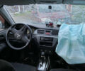 Сірий Міцубісі Lancer, об'ємом двигуна 1.58 л та пробігом 230 тис. км за 1400 $, фото 6 на Automoto.ua