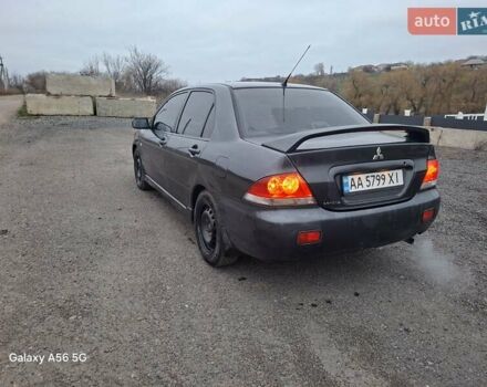 Серый Мицубиси Лансер, объемом двигателя 1.6 л и пробегом 305 тыс. км за 4000 $, фото 3 на Automoto.ua