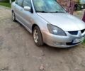 Серый Мицубиси Лансер, объемом двигателя 1.6 л и пробегом 190 тыс. км за 3300 $, фото 1 на Automoto.ua