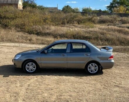 Сірий Міцубісі Lancer, об'ємом двигуна 1.6 л та пробігом 264 тис. км за 5000 $, фото 2 на Automoto.ua