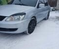 Сірий Міцубісі Lancer, об'ємом двигуна 1.58 л та пробігом 260 тис. км за 2800 $, фото 2 на Automoto.ua