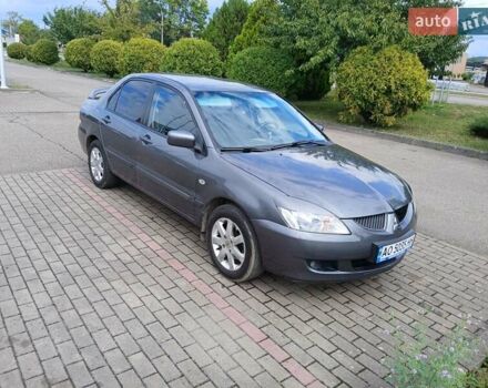 Сірий Міцубісі Lancer, об'ємом двигуна 1.58 л та пробігом 200 тис. км за 4000 $, фото 10 на Automoto.ua