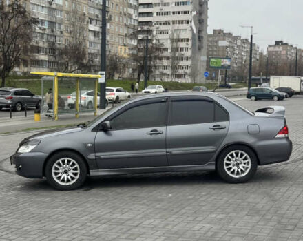 Серый Мицубиси Лансер, объемом двигателя 1.58 л и пробегом 237 тыс. км за 2999 $, фото 1 на Automoto.ua