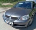 Сірий Міцубісі Lancer, об'ємом двигуна 1.58 л та пробігом 200 тис. км за 4800 $, фото 1 на Automoto.ua