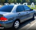 Сірий Міцубісі Lancer, об'ємом двигуна 1.6 л та пробігом 214 тис. км за 3800 $, фото 1 на Automoto.ua