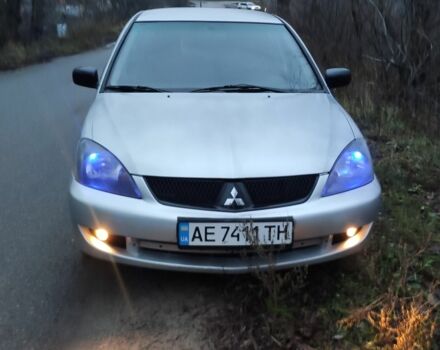 Серый Мицубиси Лансер, объемом двигателя 1.6 л и пробегом 235 тыс. км за 2850 $, фото 1 на Automoto.ua