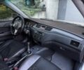 Серый Мицубиси Лансер, объемом двигателя 2 л и пробегом 260 тыс. км за 3400 $, фото 21 на Automoto.ua