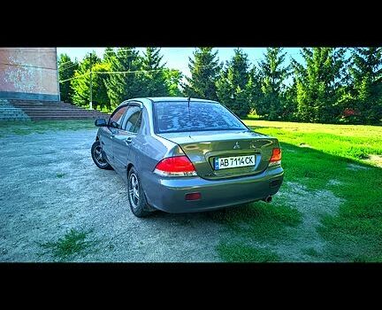 Сірий Міцубісі Lancer, об'ємом двигуна 1.6 л та пробігом 301 тис. км за 3700 $, фото 3 на Automoto.ua
