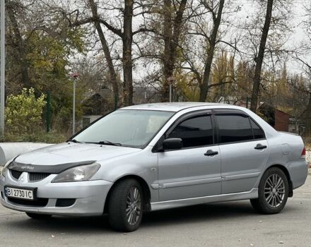 Серый Мицубиси Лансер, объемом двигателя 1.6 л и пробегом 250 тыс. км за 2600 $, фото 2 на Automoto.ua