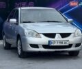 Сірий Міцубісі Lancer, об'ємом двигуна 1.58 л та пробігом 188 тис. км за 3799 $, фото 3 на Automoto.ua