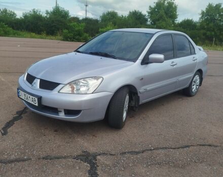 Серый Мицубиси Лансер, объемом двигателя 1.6 л и пробегом 250 тыс. км за 3600 $, фото 2 на Automoto.ua