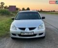 Сірий Міцубісі Lancer, об'ємом двигуна 1.58 л та пробігом 200 тис. км за 3599 $, фото 1 на Automoto.ua