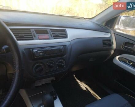 Сірий Міцубісі Lancer, об'ємом двигуна 1.6 л та пробігом 244 тис. км за 3300 $, фото 9 на Automoto.ua
