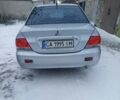 Сірий Міцубісі Lancer, об'ємом двигуна 1.58 л та пробігом 260 тис. км за 2800 $, фото 4 на Automoto.ua