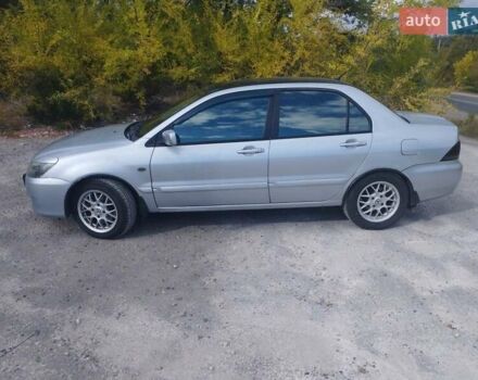 Сірий Міцубісі Lancer, об'ємом двигуна 1.6 л та пробігом 244 тис. км за 3300 $, фото 5 на Automoto.ua
