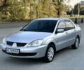 Серый Мицубиси Лансер, объемом двигателя 1.6 л и пробегом 170 тыс. км за 3512 $, фото 1 на Automoto.ua