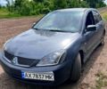 Серый Мицубиси Лансер, объемом двигателя 2 л и пробегом 326 тыс. км за 3600 $, фото 1 на Automoto.ua