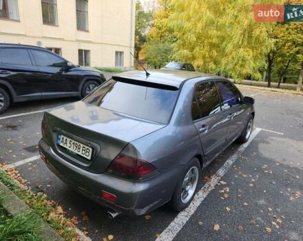 Серый Мицубиси Лансер, объемом двигателя 1.58 л и пробегом 293 тыс. км за 4000 $, фото 5 на Automoto.ua
