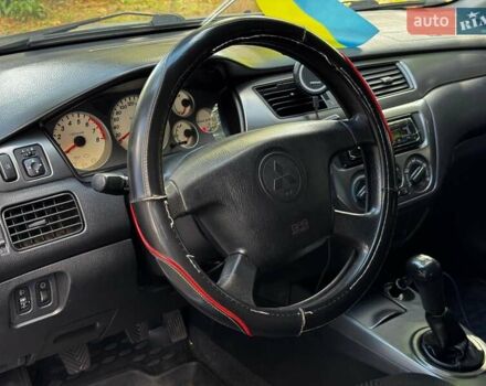 Серый Мицубиси Лансер, объемом двигателя 1.6 л и пробегом 196 тыс. км за 4490 $, фото 13 на Automoto.ua