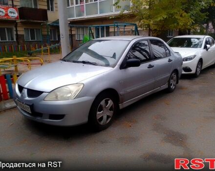 Сірий Міцубісі Lancer, об'ємом двигуна 1.6 л та пробігом 360 тис. км за 1999 $, фото 5 на Automoto.ua
