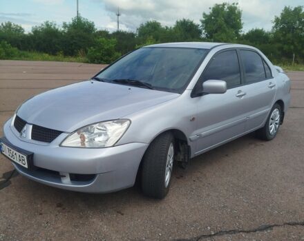 Серый Мицубиси Лансер, объемом двигателя 1.6 л и пробегом 250 тыс. км за 3600 $, фото 3 на Automoto.ua