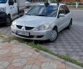 Серый Мицубиси Лансер, объемом двигателя 1.6 л и пробегом 155 тыс. км за 4000 $, фото 3 на Automoto.ua