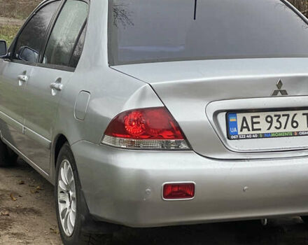 Серый Мицубиси Лансер, объемом двигателя 1.58 л и пробегом 210 тыс. км за 3900 $, фото 5 на Automoto.ua