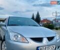 Серый Мицубиси Лансер, объемом двигателя 1.58 л и пробегом 303 тыс. км за 3900 $, фото 1 на Automoto.ua